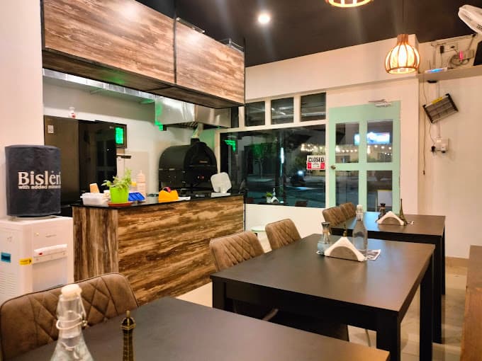 Inside Mom's Pizza kitchen and dine-in area
